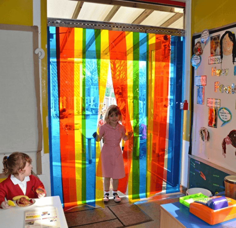 Nursery Free Flow Curtains Kid Walking Through Multi-coloured curtains into Nursery