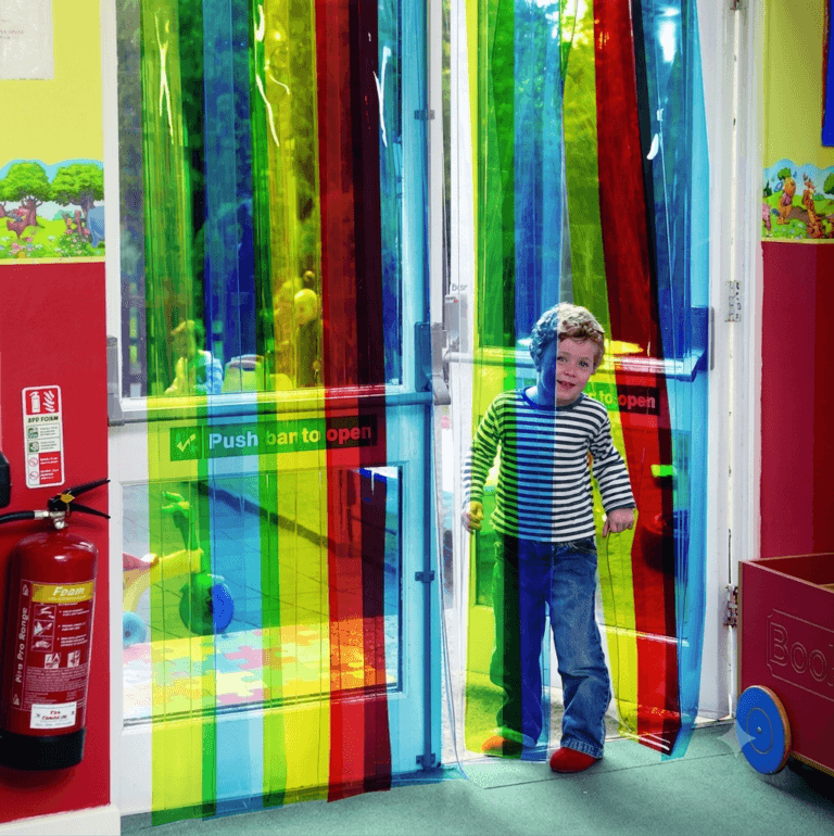 Nursery Free Flow Curtains Kid Walking Through Multi-coloured curtains into Nursery